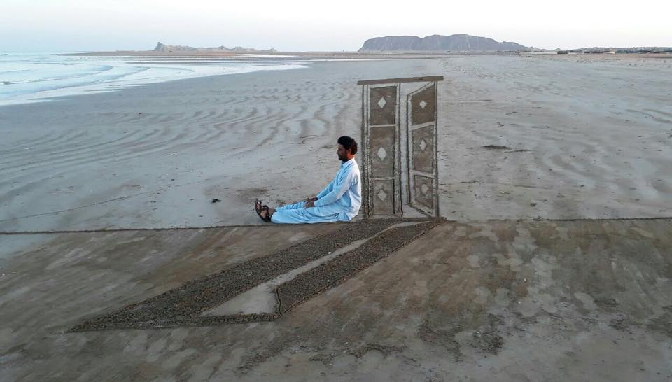 Artist relaxing outside his newly hand drawn home